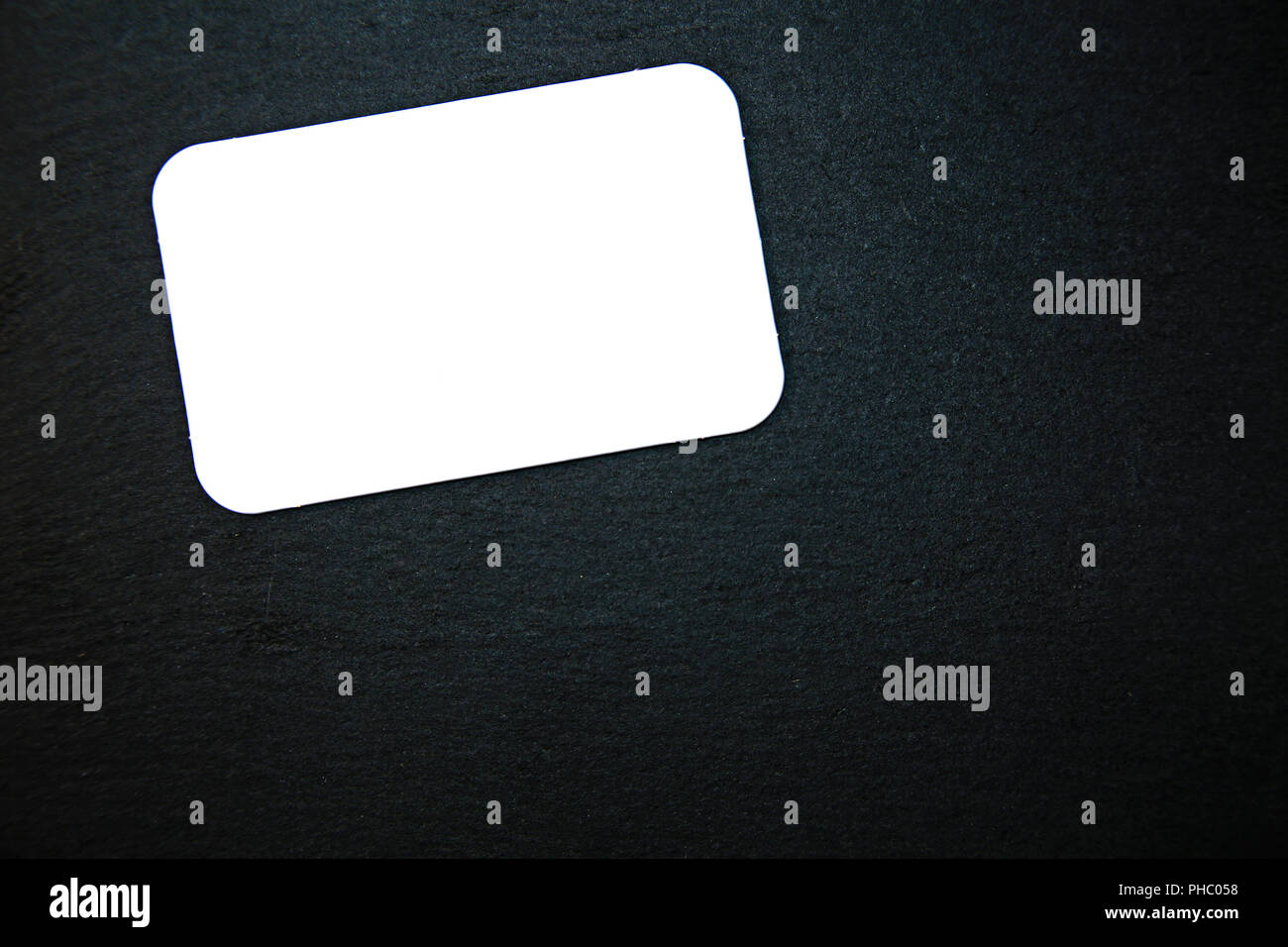 Blackboard with blank notepad Stock Photo Alamy