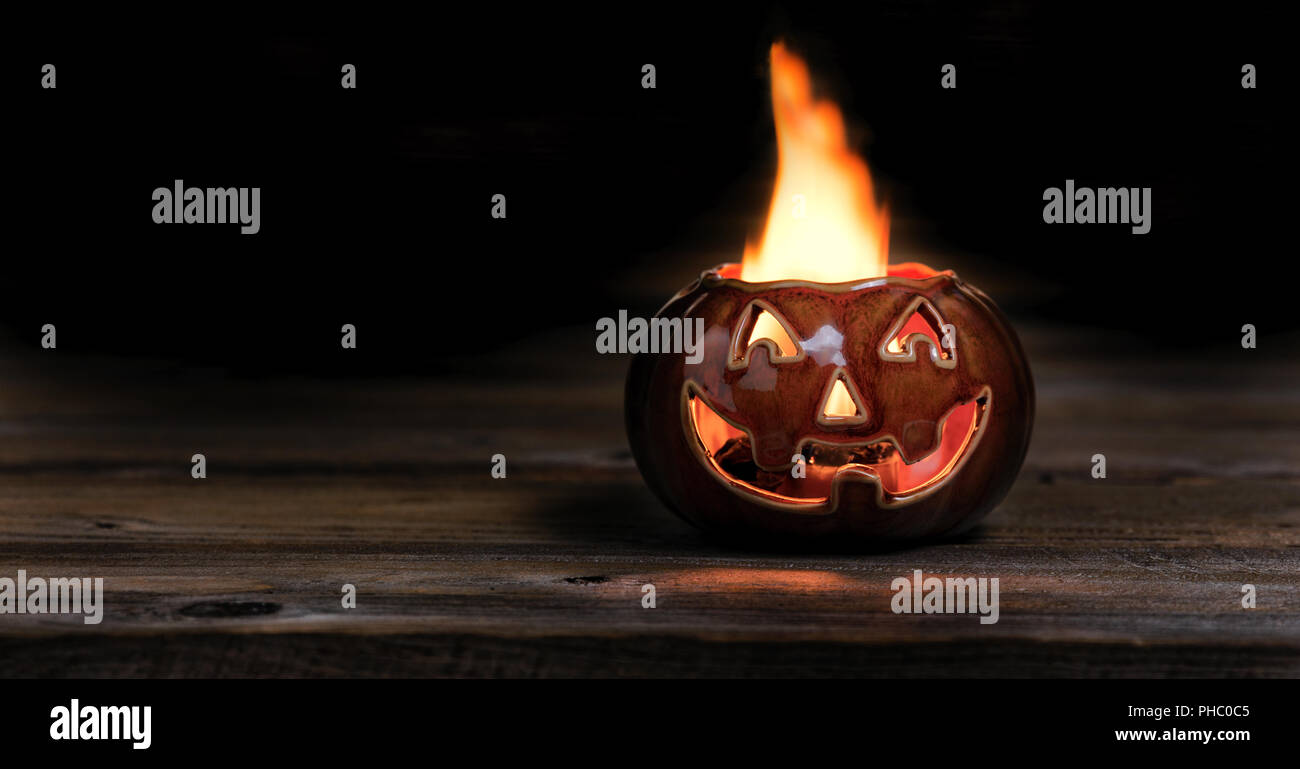 Halloween pumpkin on fire during the night time Stock Photo