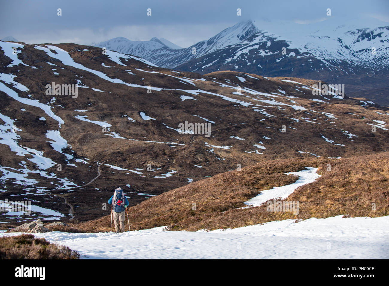 A walker at the top of the Devils Staircase while hiking along the West Highland Way near Glencoe in the Scottish Highlands, Scotland, United Kingdom Stock Photo