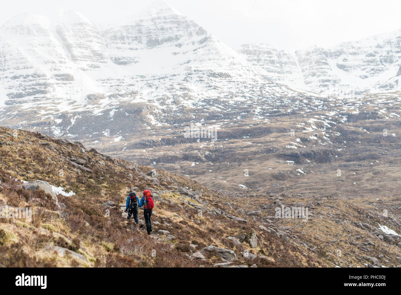 Hiking in the Scottish Highlands in Torridon along The Cape Wrath Trail towards Loch Coire Mhic Fhearchair, Highlands, Scotland, United Kingdom Stock Photo
