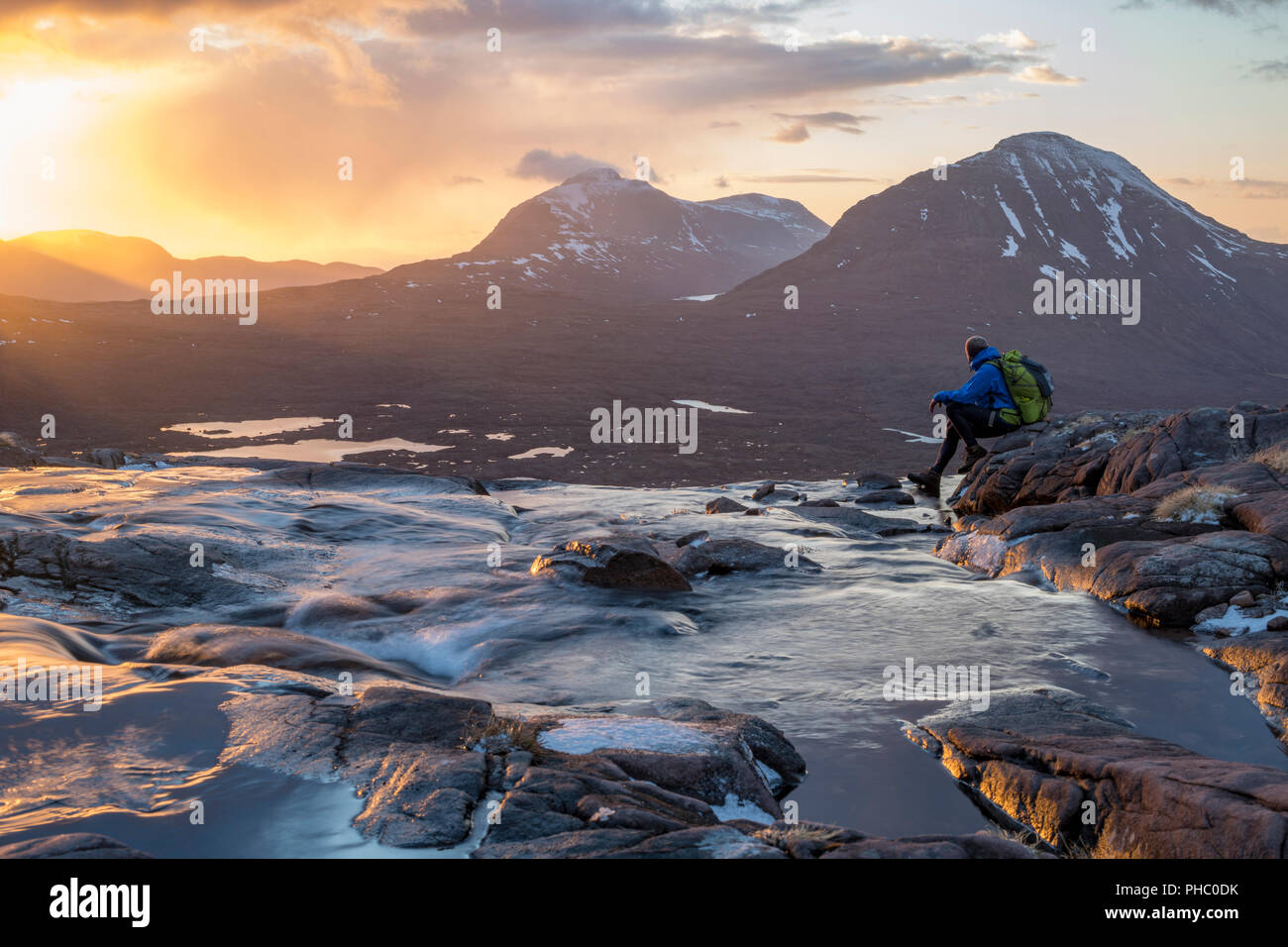 Hiking in the Scottish Highlands in Torridon along The Cape Wrath Trail near Loch Coire Mhic Fhearchair, Highlands, Scotland, United Kingdom, Europe Stock Photo