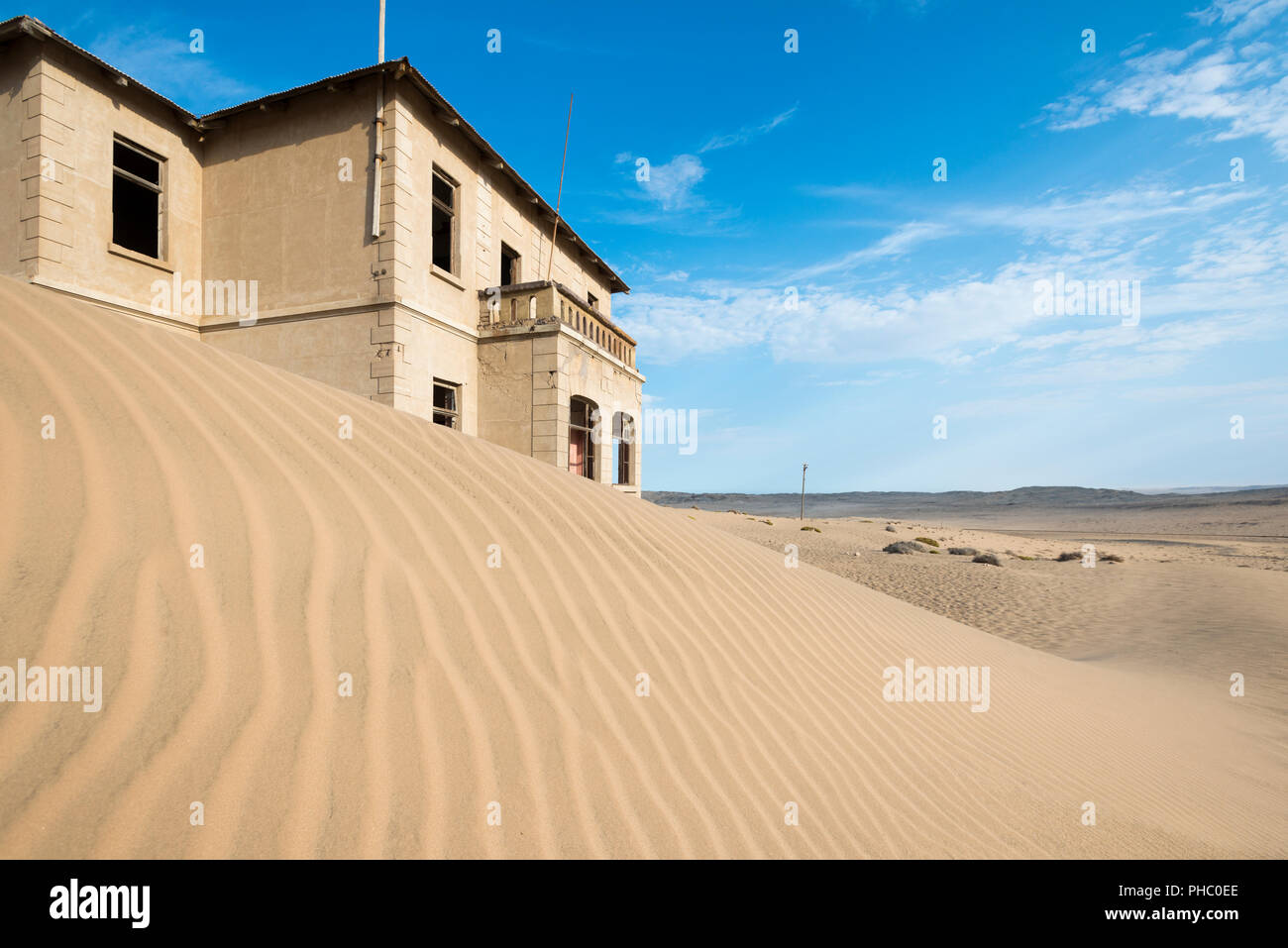 A building in the abandoned diamond mining ghost town of Kolmanskop, Namibia, Africa Stock Photo