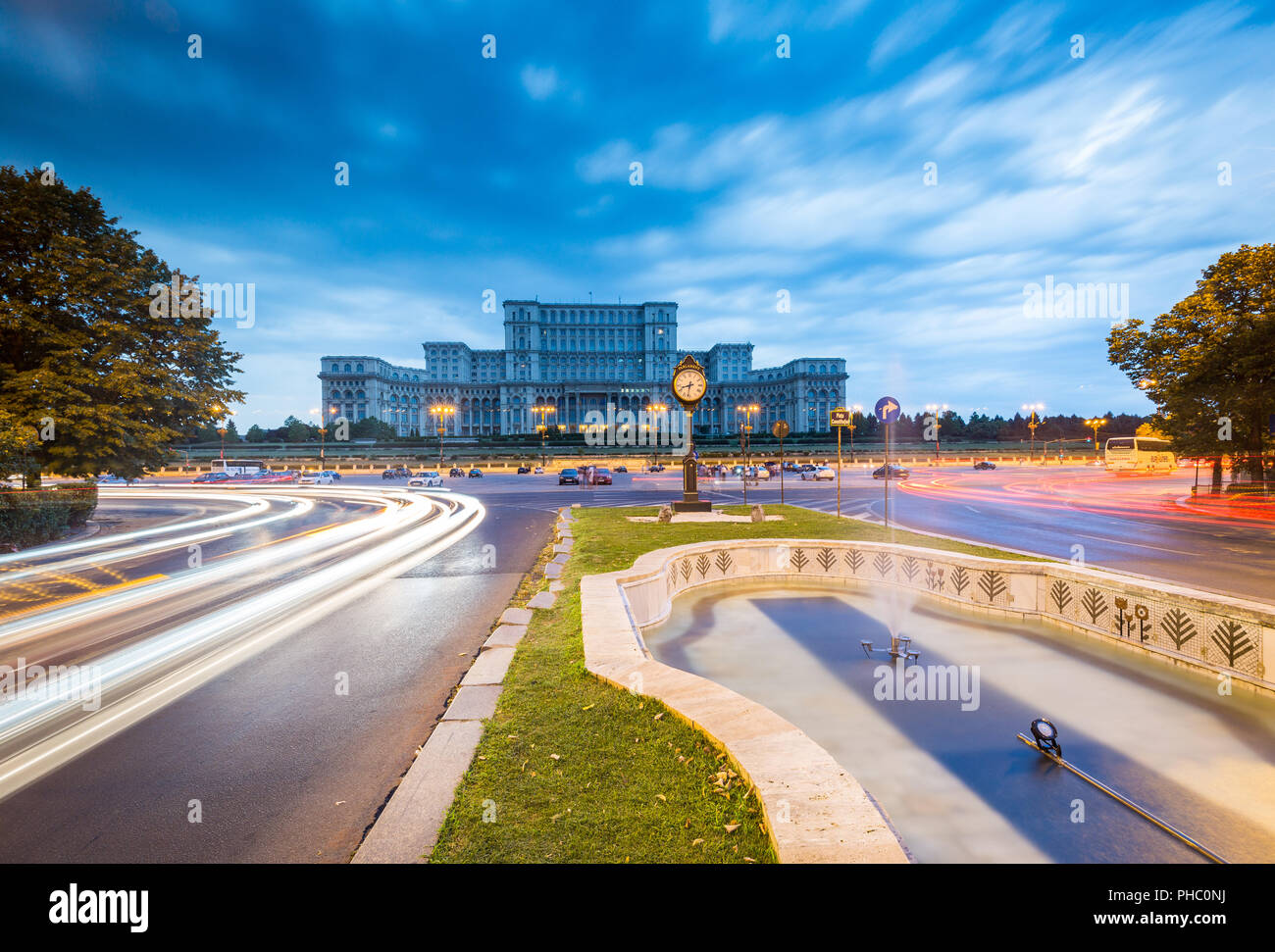 Car light trails at blue hour in front of the huge Palace of Parliament (Palatul Parlamentului), Bucharest, Romania, Europe Stock Photo