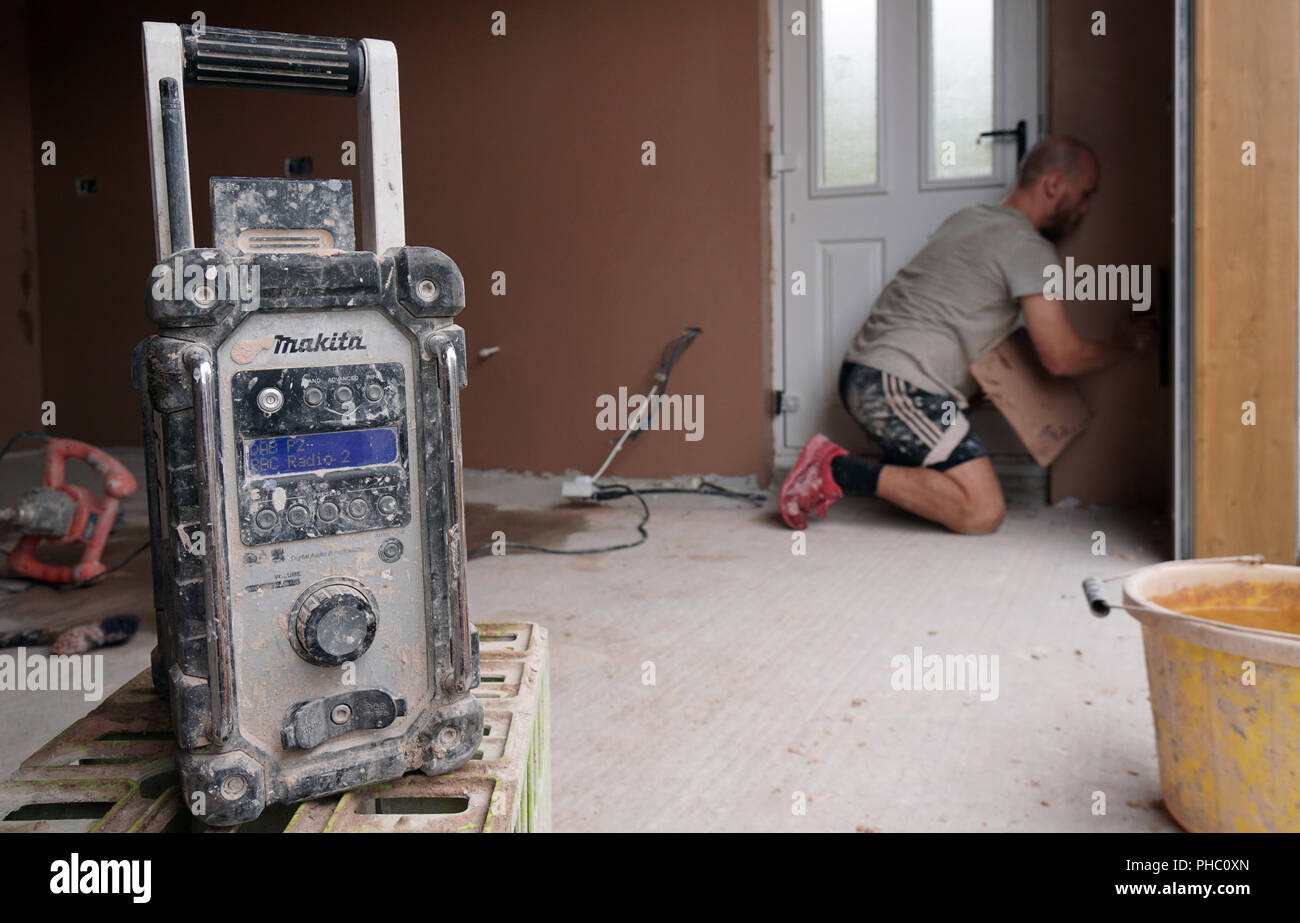 A Plasterers Radio has a very hard life, on a building site. Stock Photo