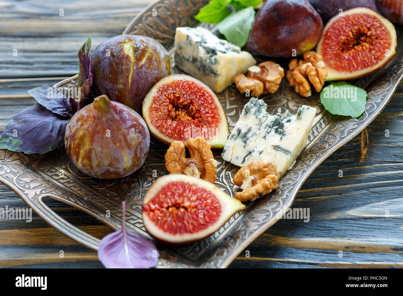 Ripe figs, blue cheese and walnuts. Stock Photo