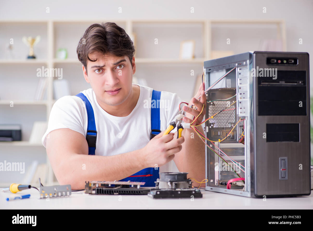 Computer repairman repairing desktop computer Stock Photo - Alamy