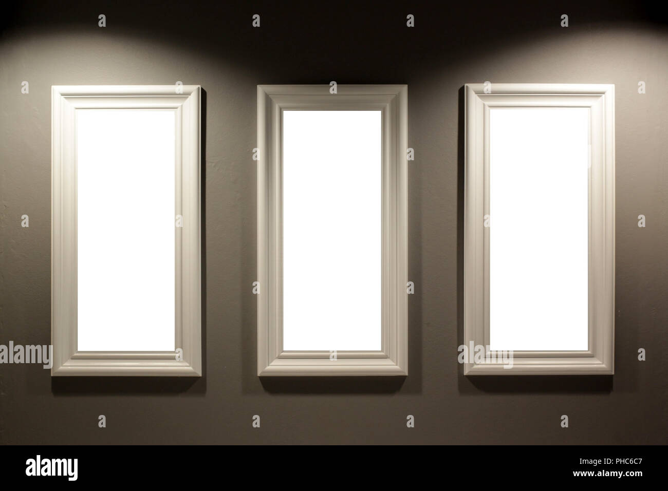 gallery interior, empty picture frames on the wall with lighting Stock Photo