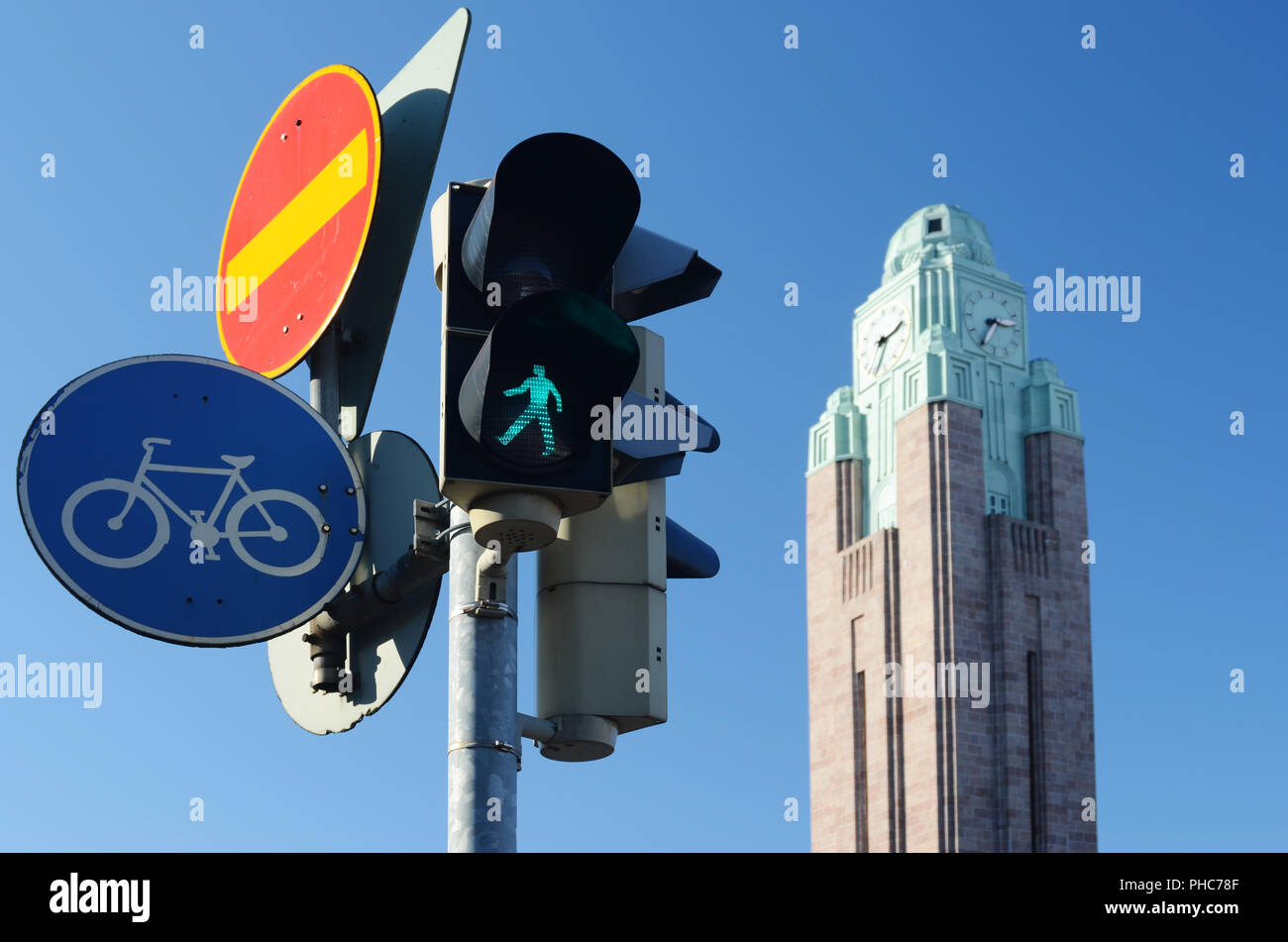 traffic lights and road signs against sky Stock Photo