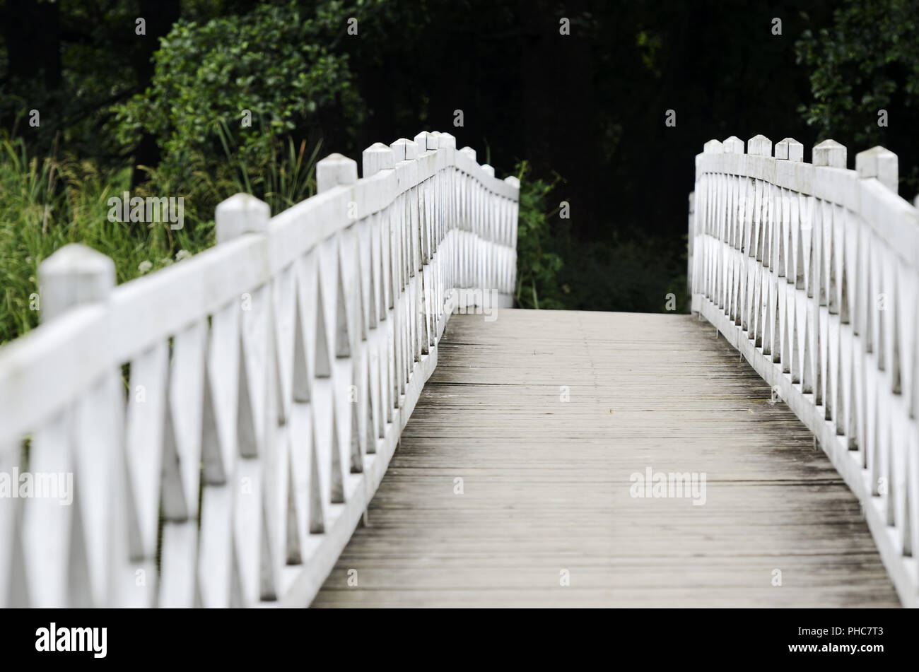 patterned wooden white foot bridge Stock Photo
