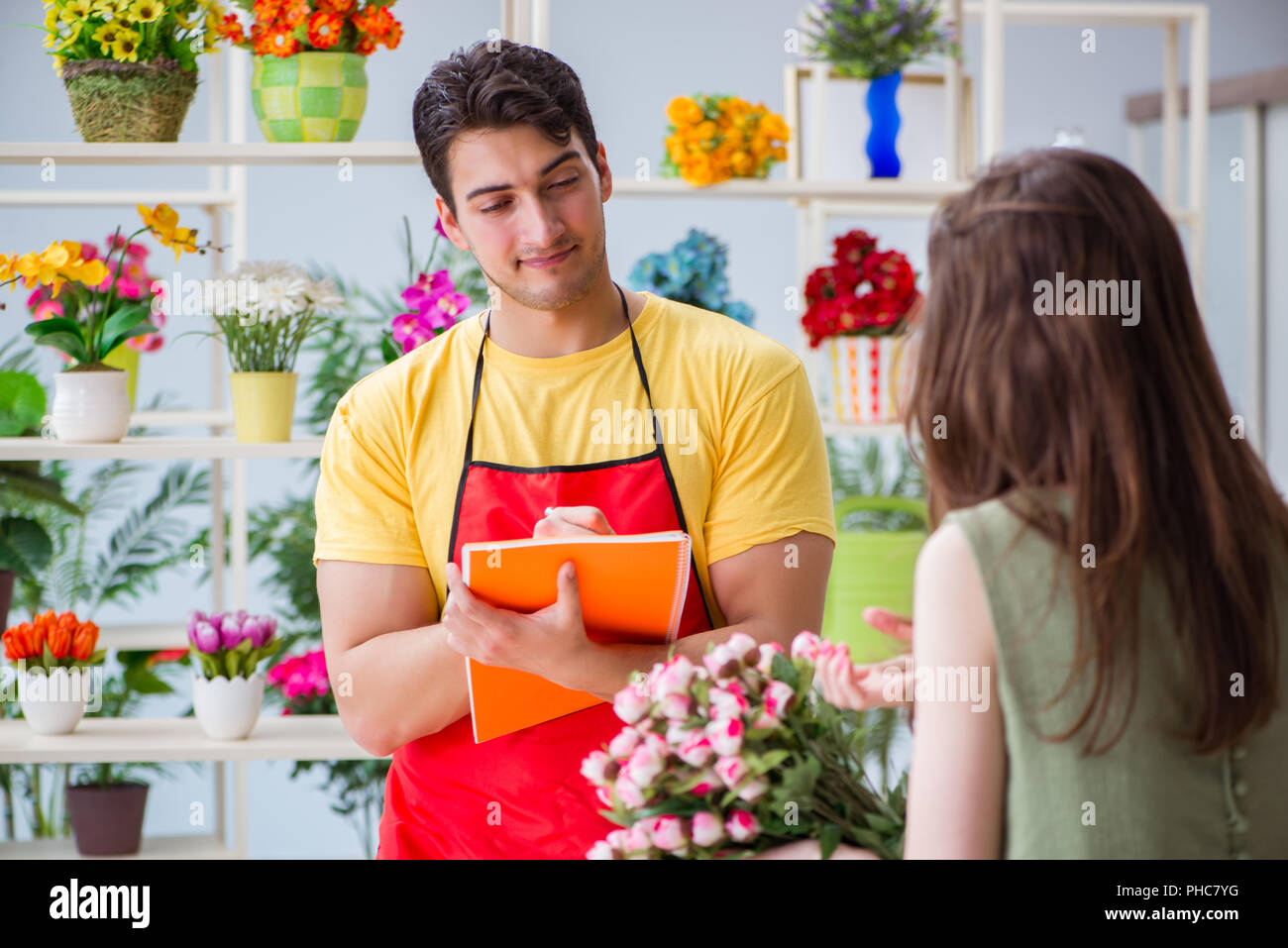 The florist selling flowers in a flower shop Stock Photo Alamy