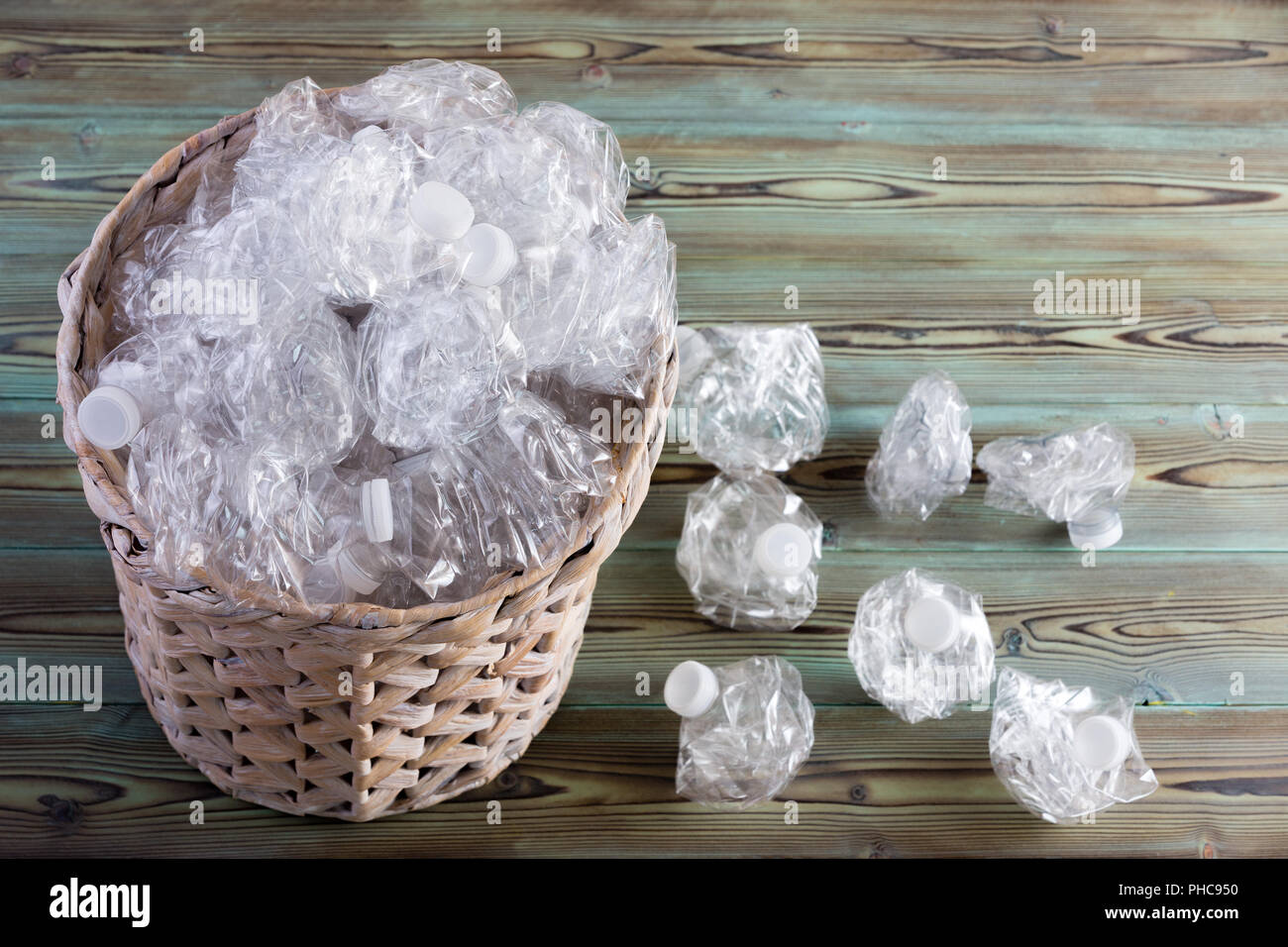 Crumpled used clean clear plastic bottles overflowing from a full