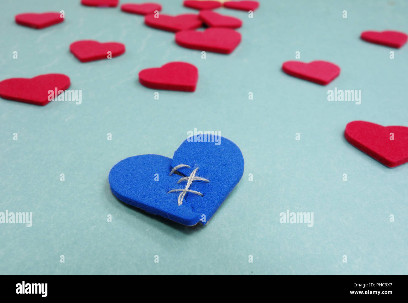 one broken blue heart Stock Photo - Alamy