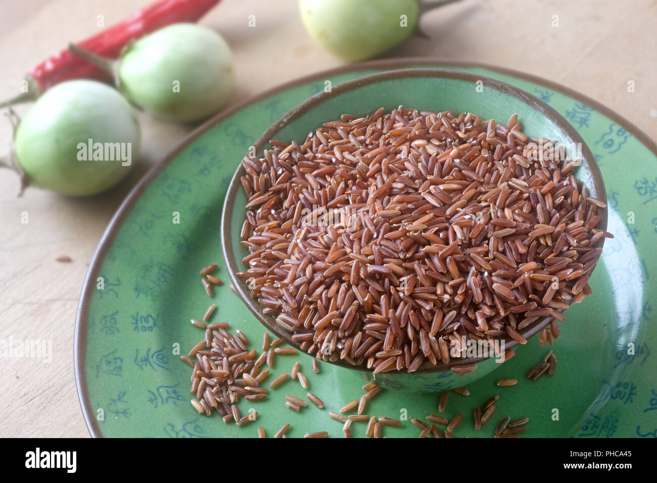 Roro Rice Red rice in a ceramic bowl Stock Photo - Alamy