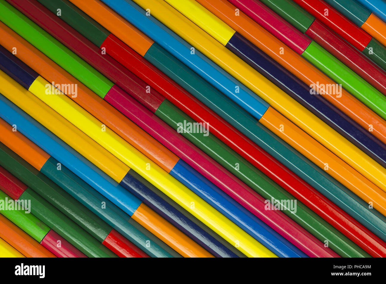 Wooden crayons as background picture Stock Photo - Alamy