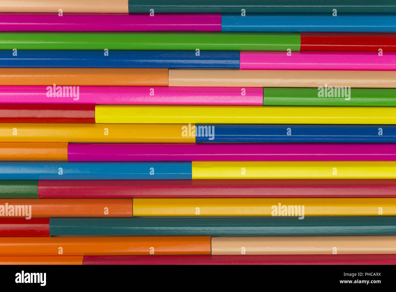 Wooden crayons as background picture Stock Photo - Alamy