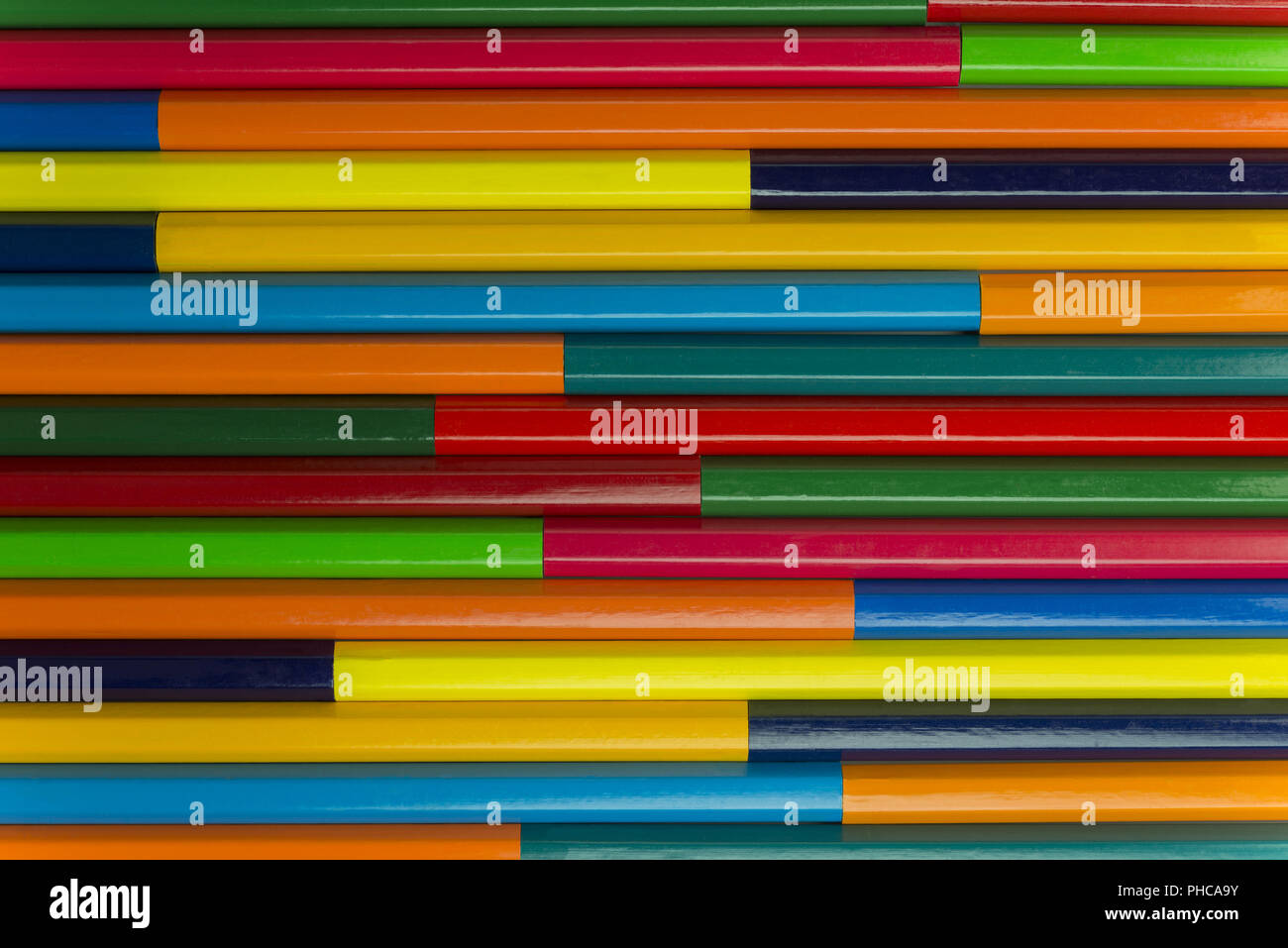 Wooden crayons as background picture Stock Photo - Alamy
