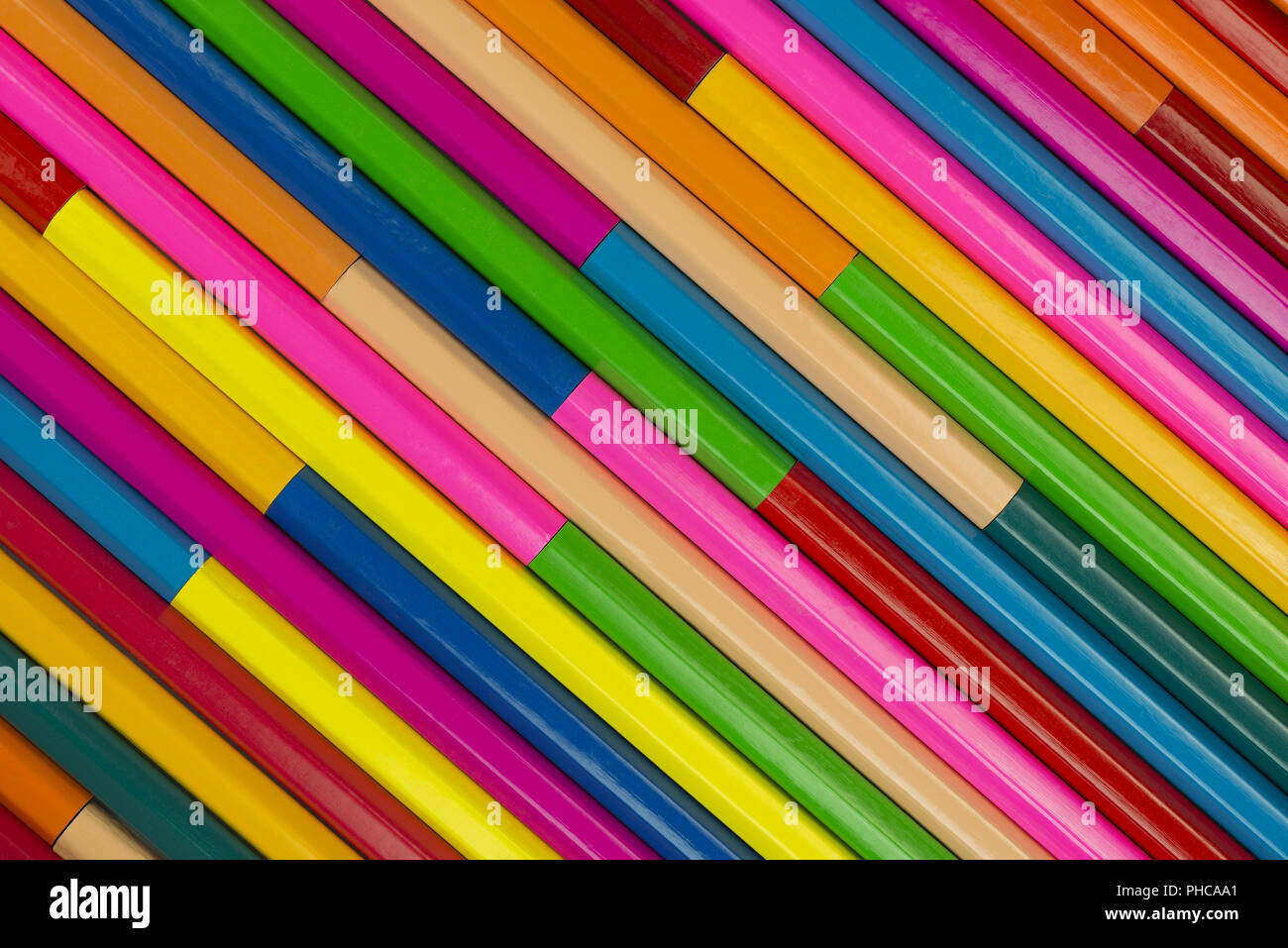 Wooden crayons as background picture Stock Photo - Alamy