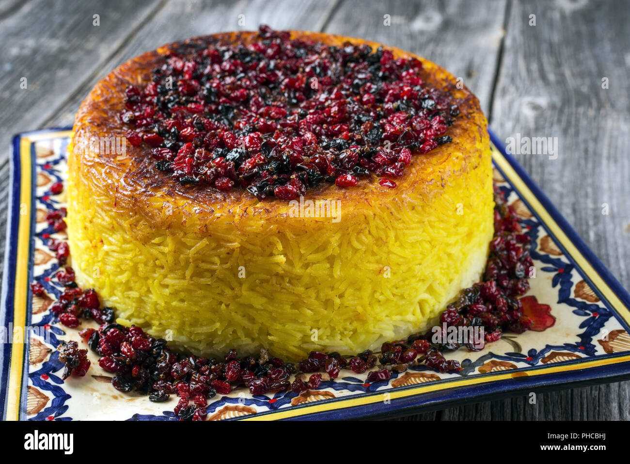 Traditional Iranian Tahdig Polo with Berberis on a plate Stock Photo