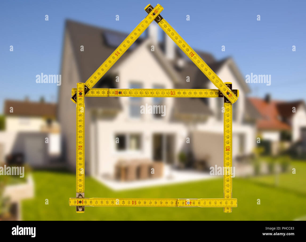 yardstick as symbol for construction of residential house Stock Photo