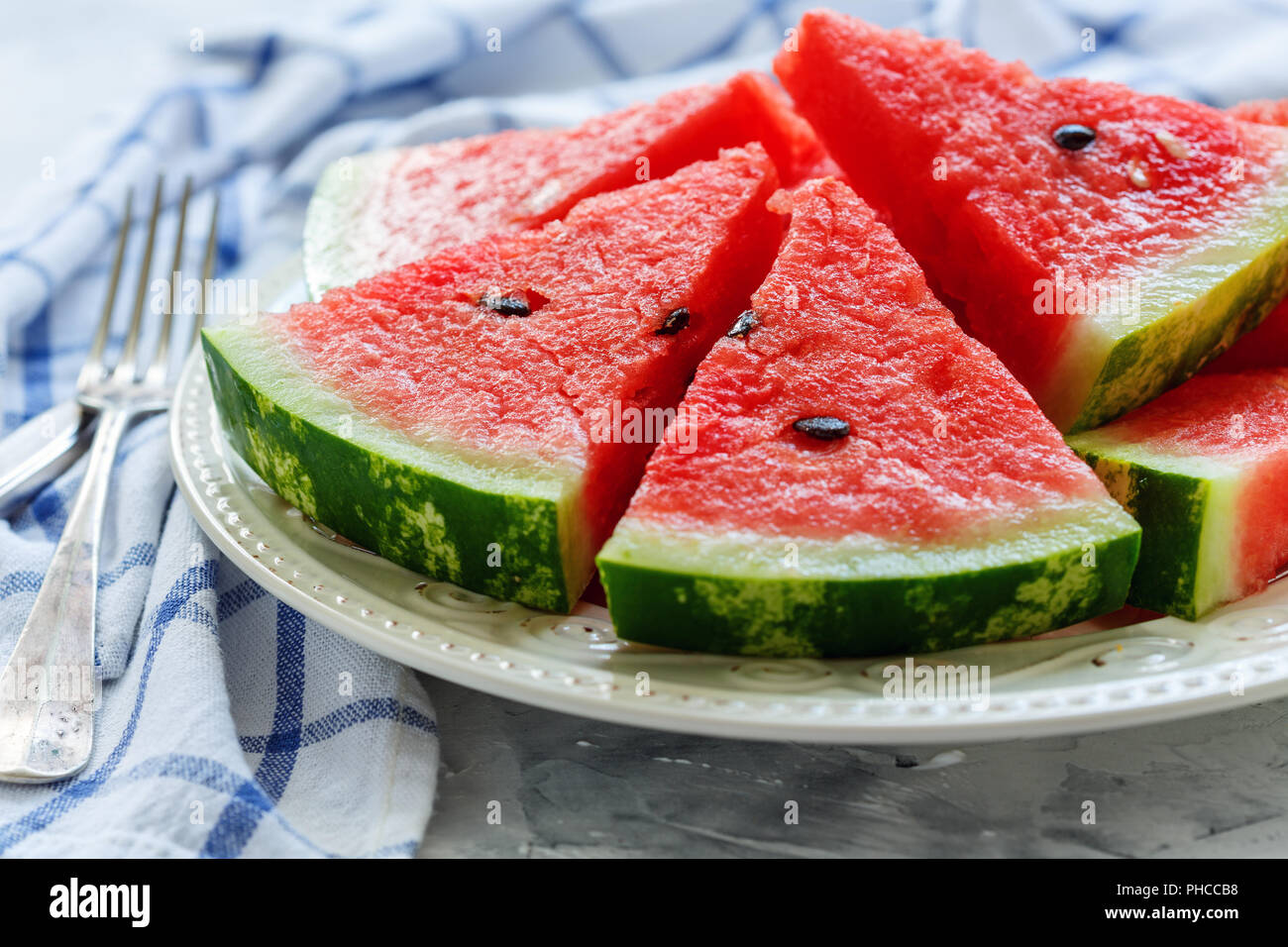 Juicy watermelon slices on a porcelain dish. Stock Photo