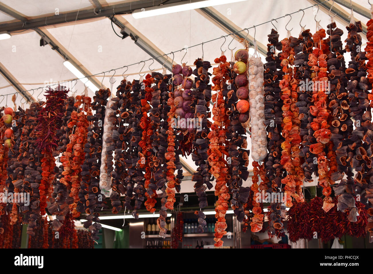 Hanged dried vegetables in Viktualienmarkt, Munich, Germany. Stock Photo