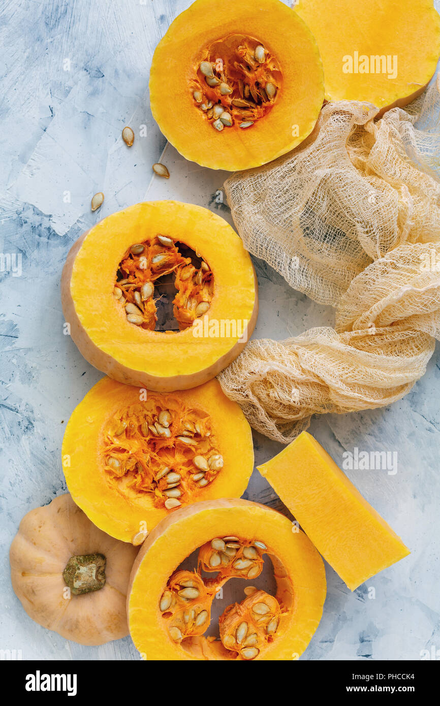Round slices of pumpkin seeds and pieces of cloth. Stock Photo