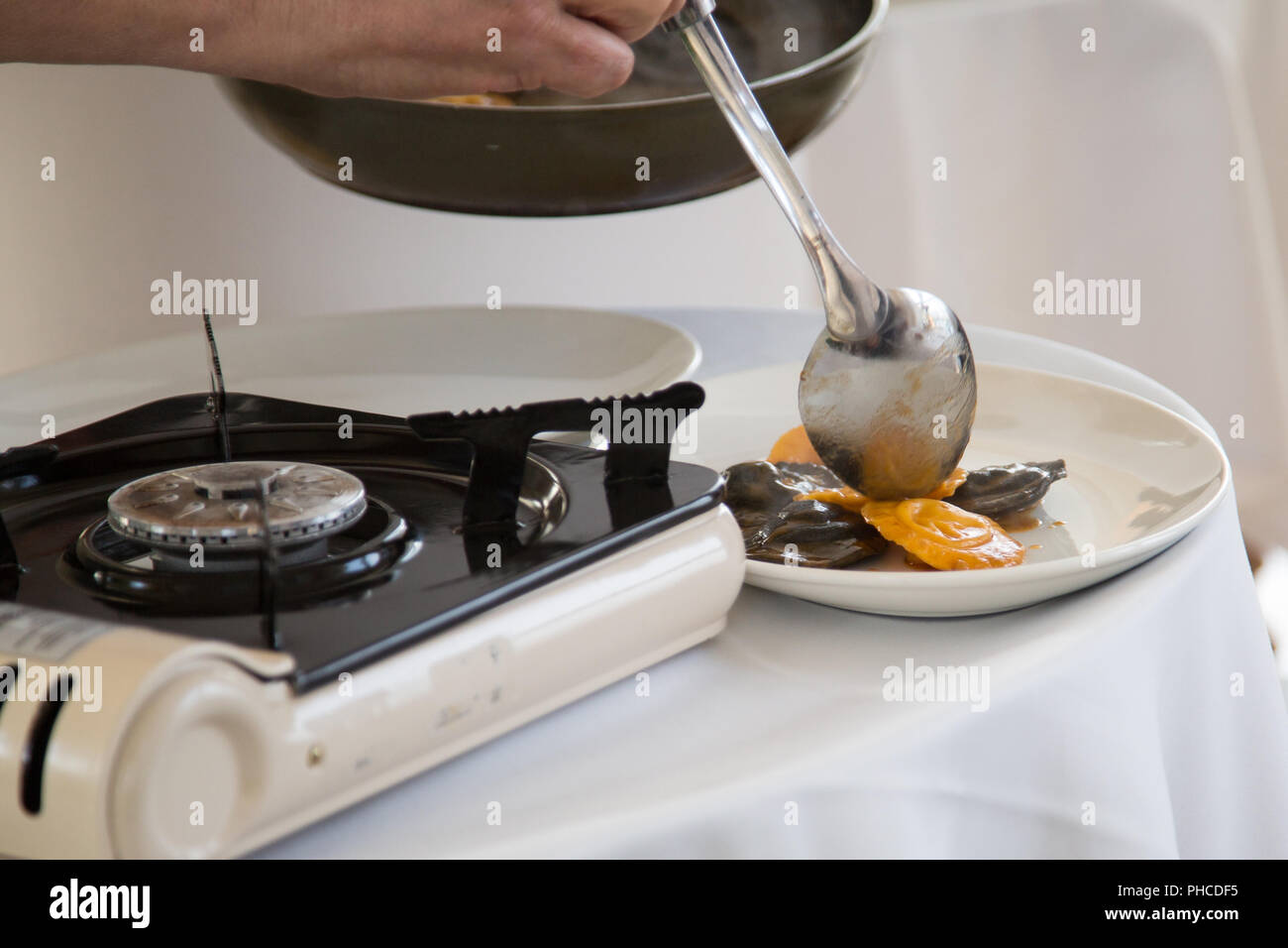 Cooking a ravioli in restaurant at masterclass Stock Photo