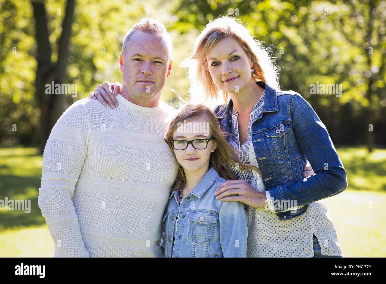 casual young family in the park Stock Photo