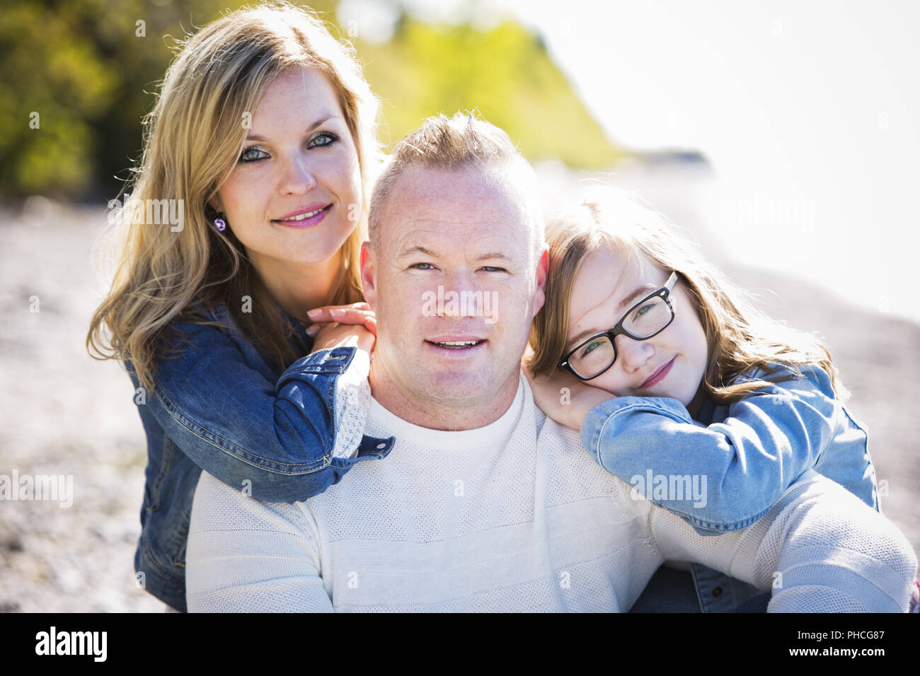 Family on the beach hi-res stock photography and images - Alamy