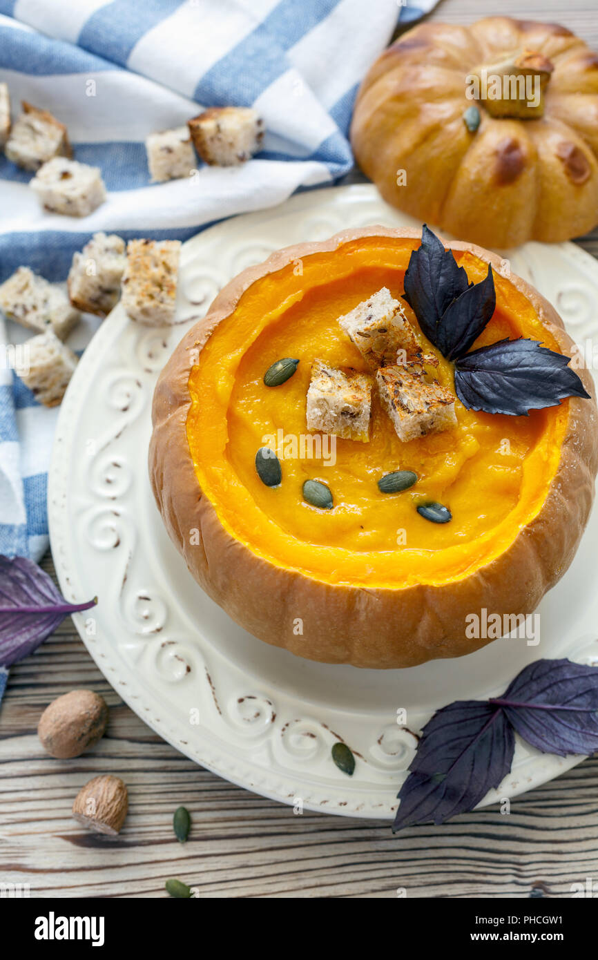 Pumpkin soup with croutons in a pumpkin Stock Photo - Alamy