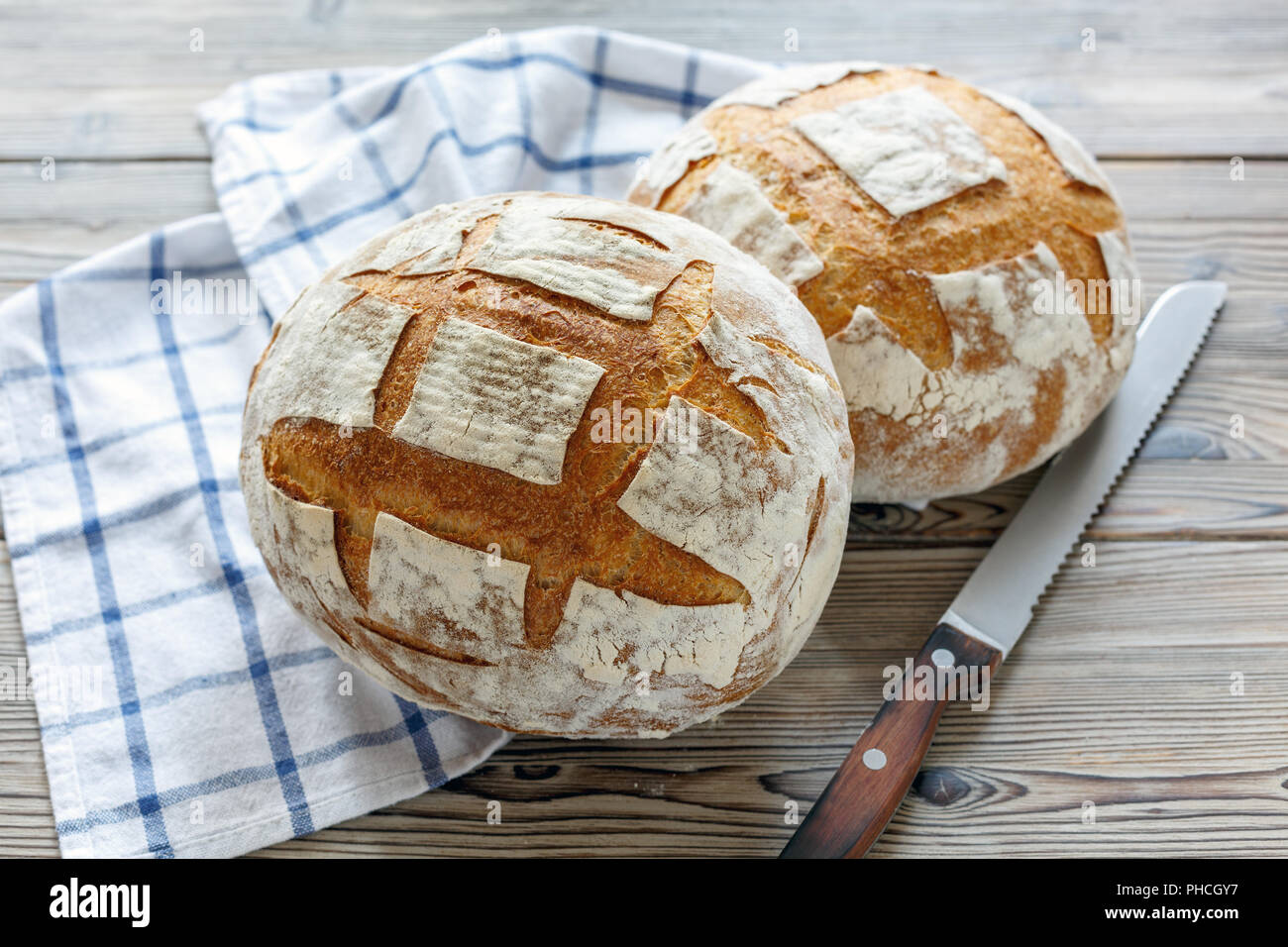 Loaves of fresh homemade sourdough bread. Stock Photo