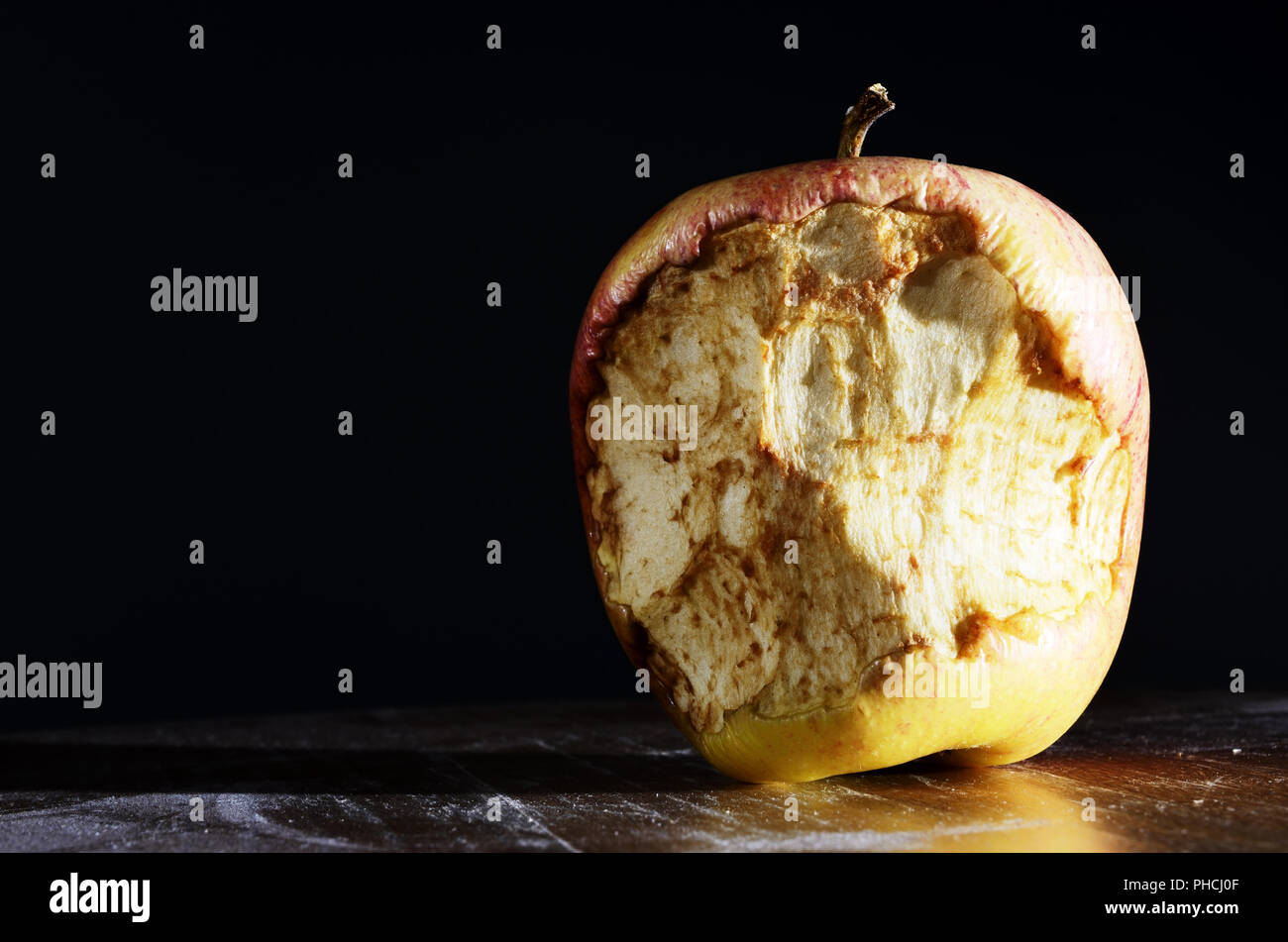 bitten apple on a dark background Stock Photo