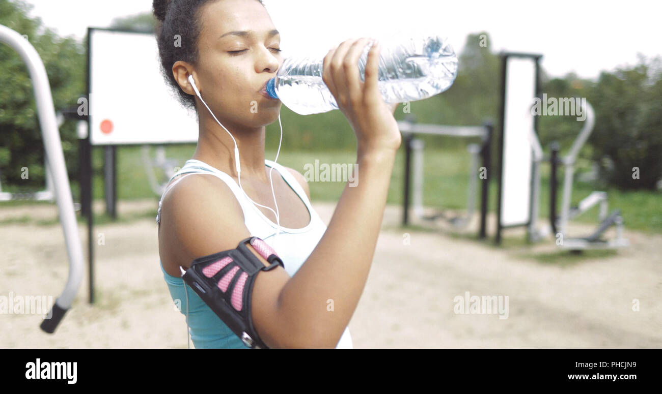 Girl drinking after workout Stock Photo Alamy