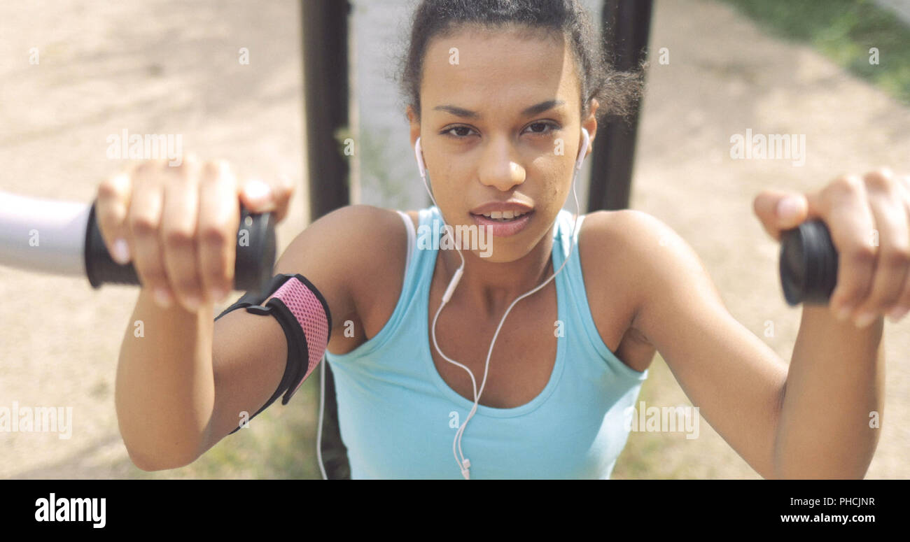 Determined sportswoman working out Stock Photo