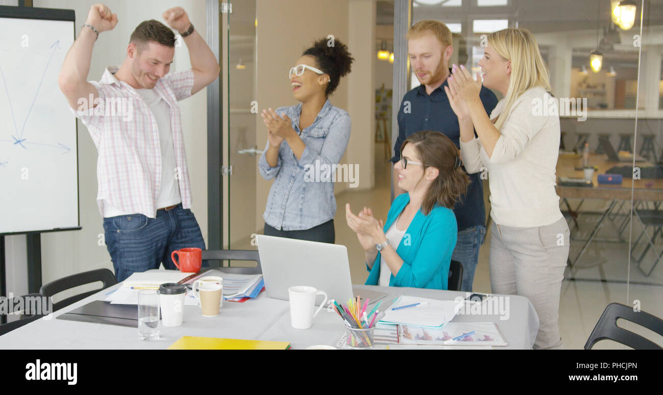 Cheerful coworkers celebrating Stock Photo