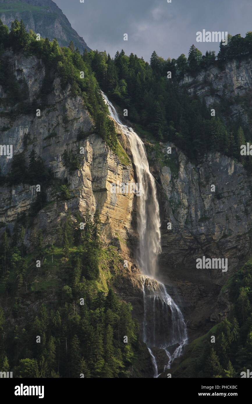 Majestic waterfall Oltschibachfall. Waterfall near Meiringen. Swiss Alps. Stock Photo
