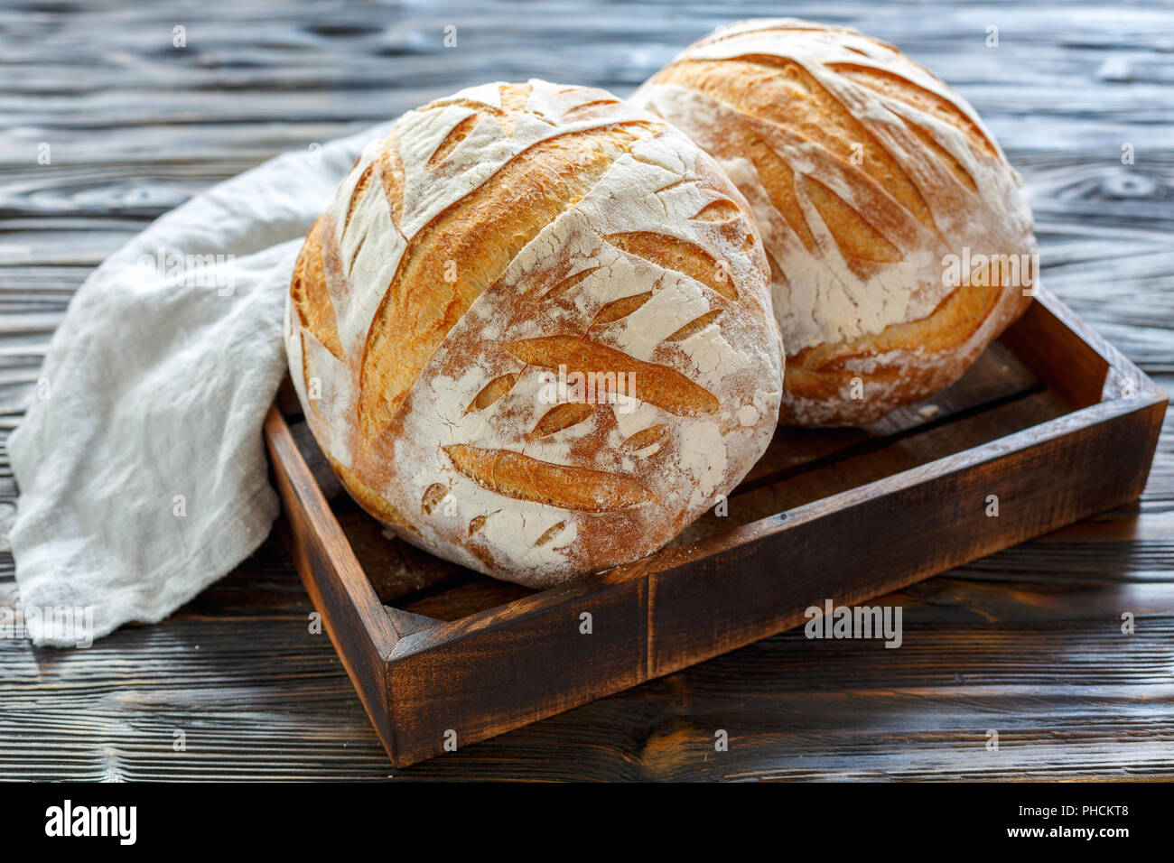 Loaves of fresh homemade sourdough bread. Stock Photo