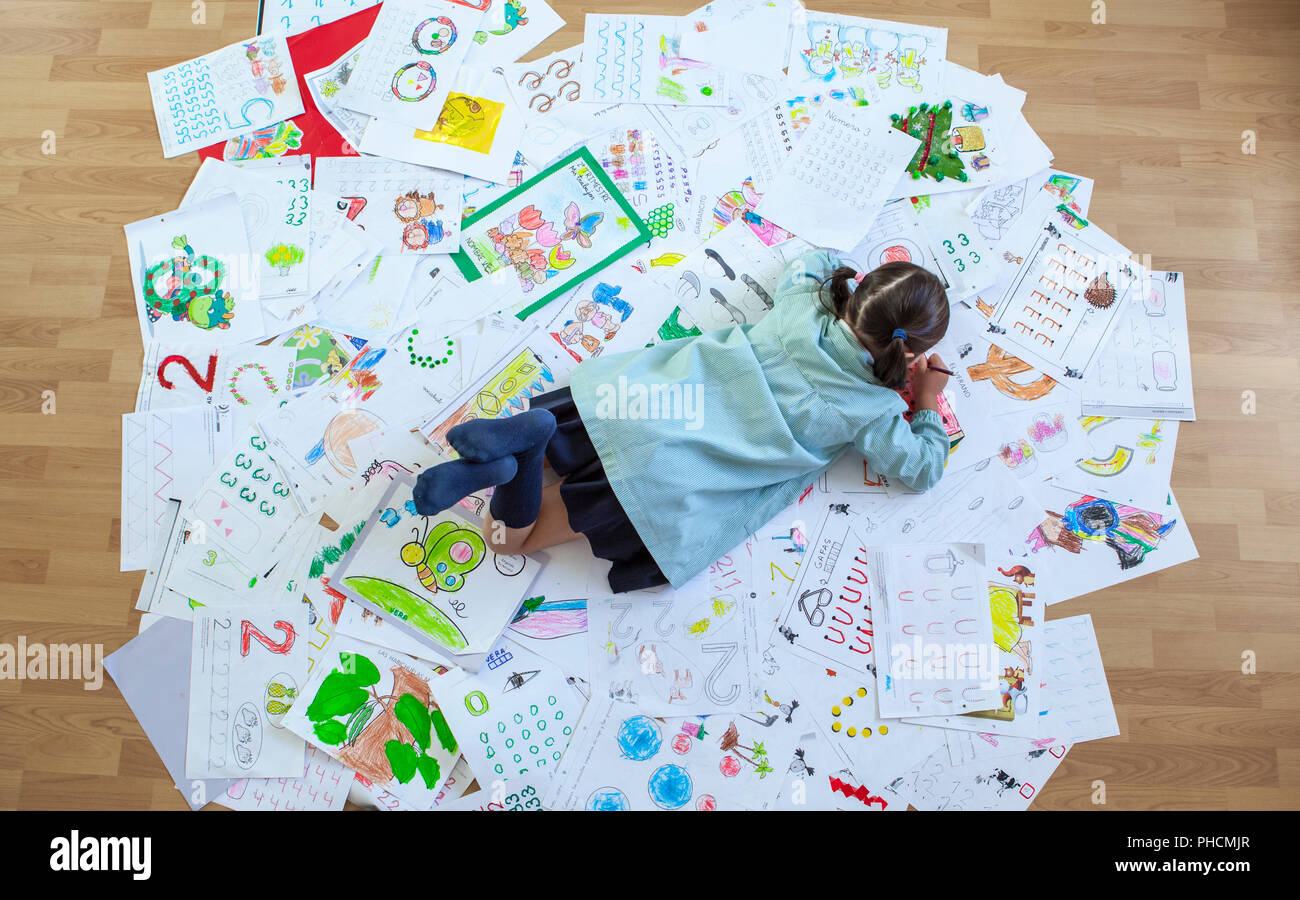 Five years student over her whole year homework. Homework overload for kids  concept Stock Photo - Alamy
