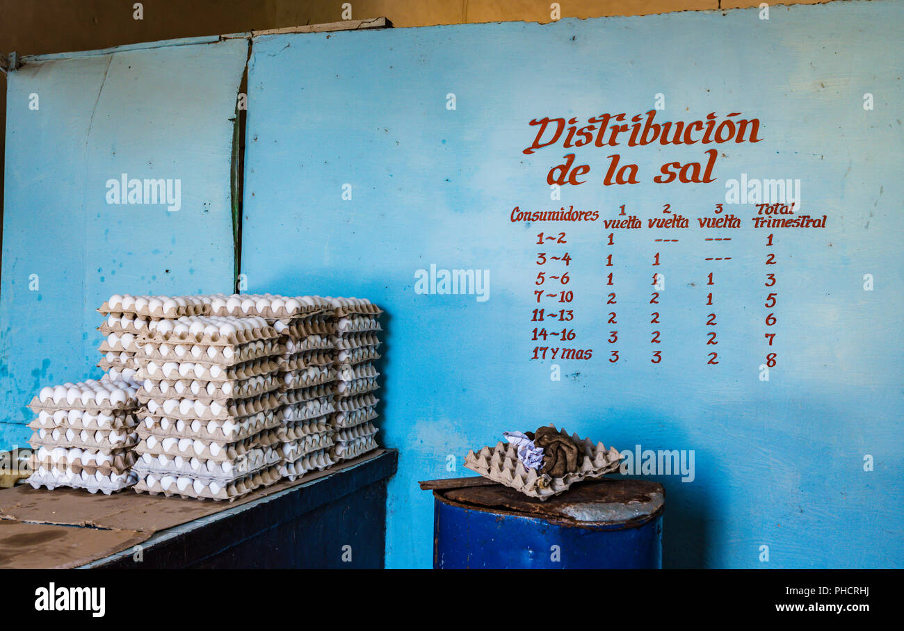 Trinidad, Cuba / March 15, 2016: Stacks of egg cartons and salt distribution quotas in Cuba where ration cards are used to limit purchase of goods. Stock Photo