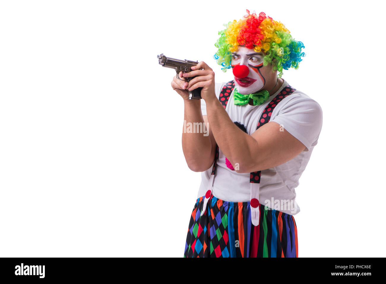 Funny clown with a gun pistol isolated on white background Stock Photo