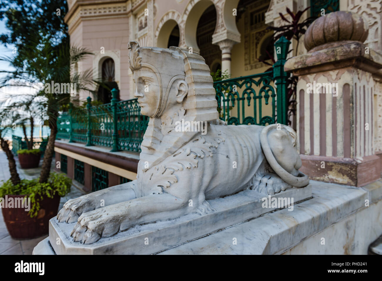 Cienfuegos, Cuba / March 15, 2016: Sphinx statue guards entrance to the Palacio de Valle, an ecclectic architectural building in a UNESCO World Herita Stock Photo