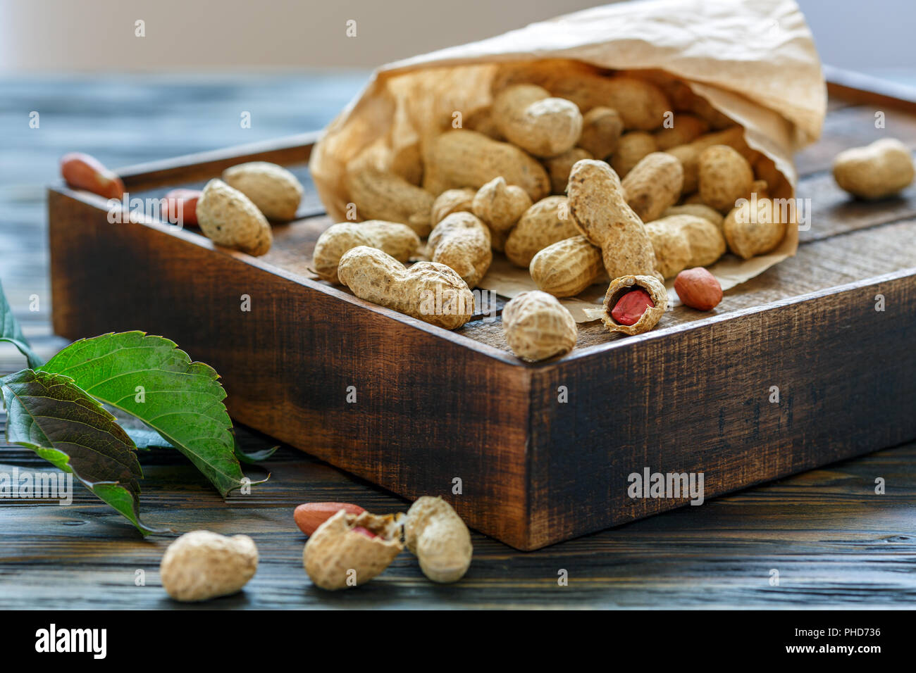 Unshelled peanuts in a paper bag. Stock Photo