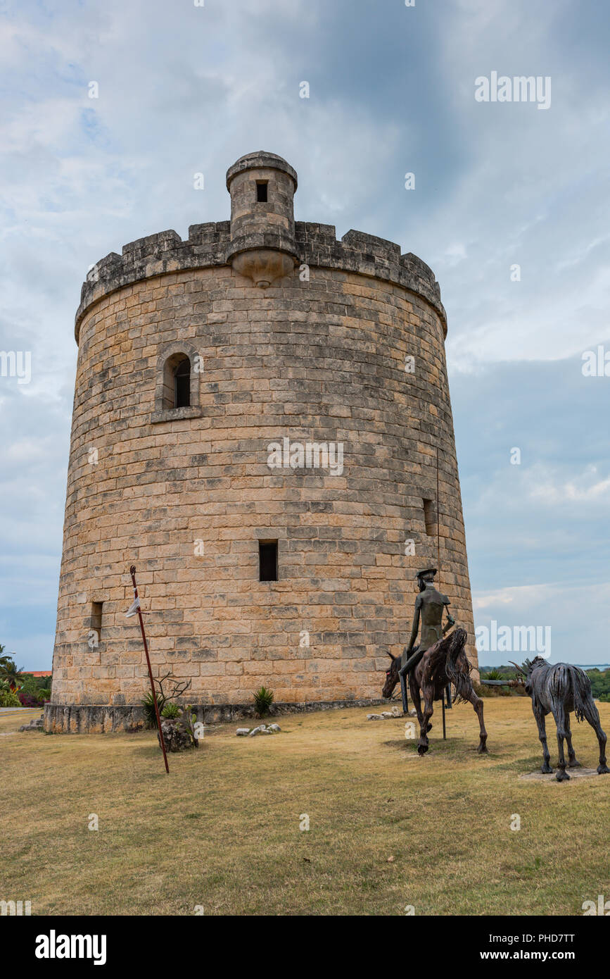 Varadero, Cuba / March 19, 2016: Castle tower and statue of Don Quixote (Quijote) in Varadero, Cuba. Stock Photo