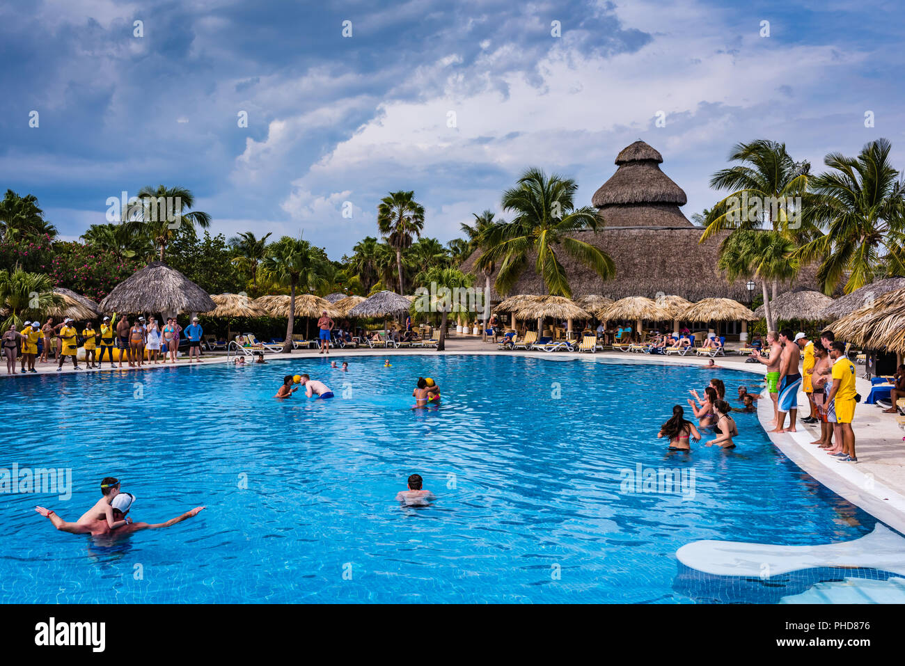 Varadero, Cuba / March 19, 2016:, 2016: Resort activity draws guests into game at luxury pool. Stock Photo