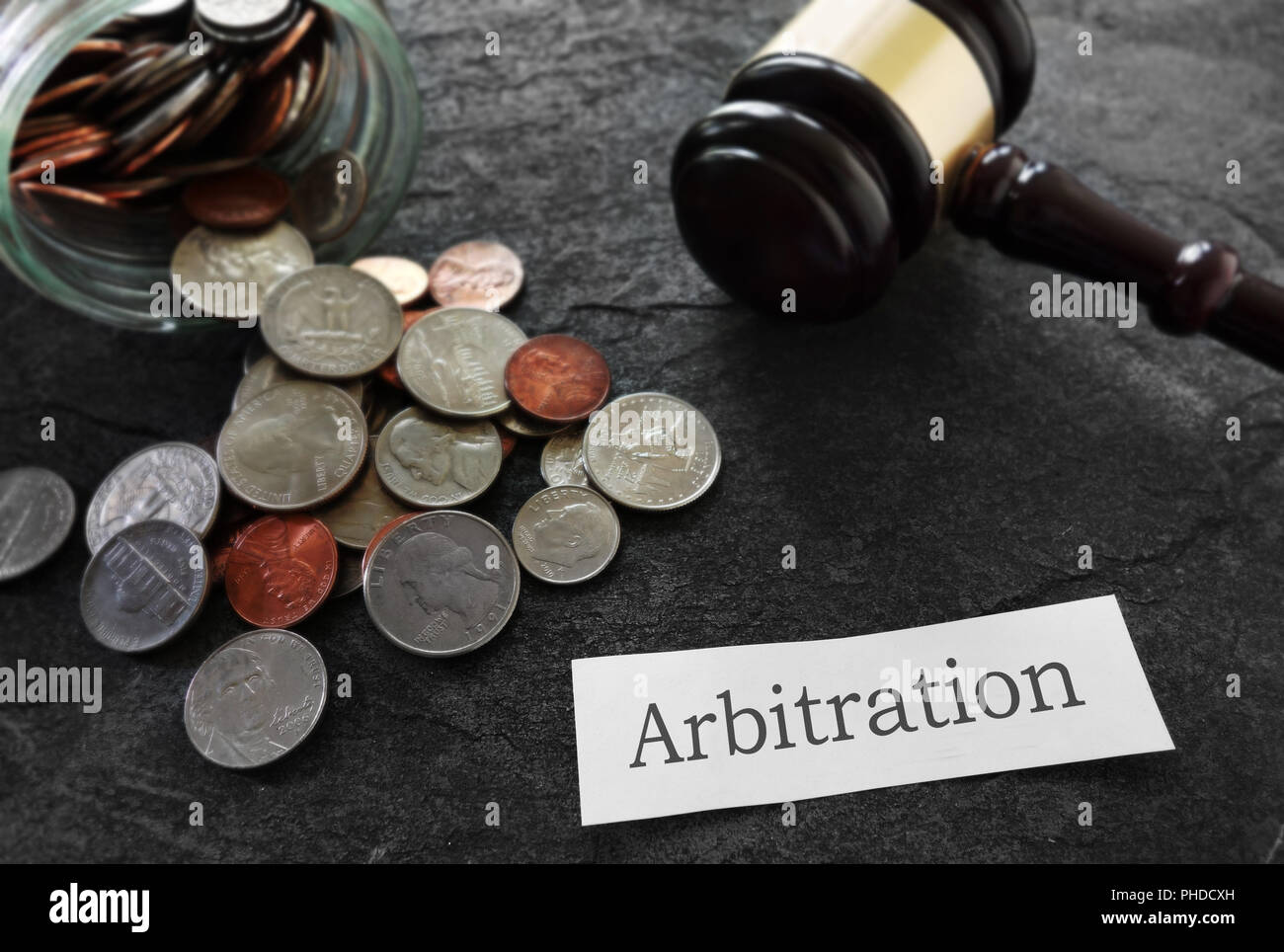 Arbitration news headline with coins and gavel Stock Photo