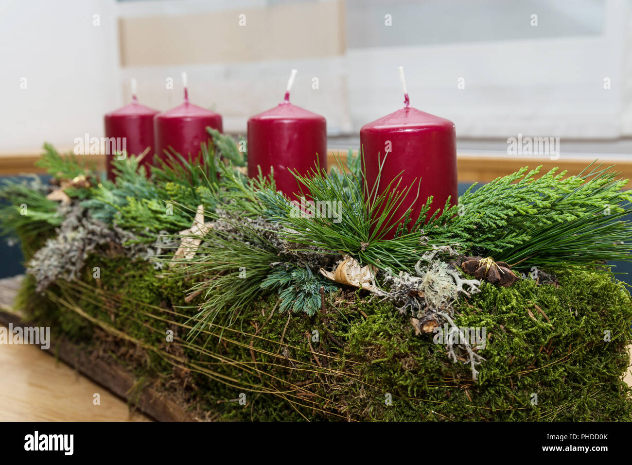 creative oblong Christmas wreath on a wooden board - closeup Stock Photo