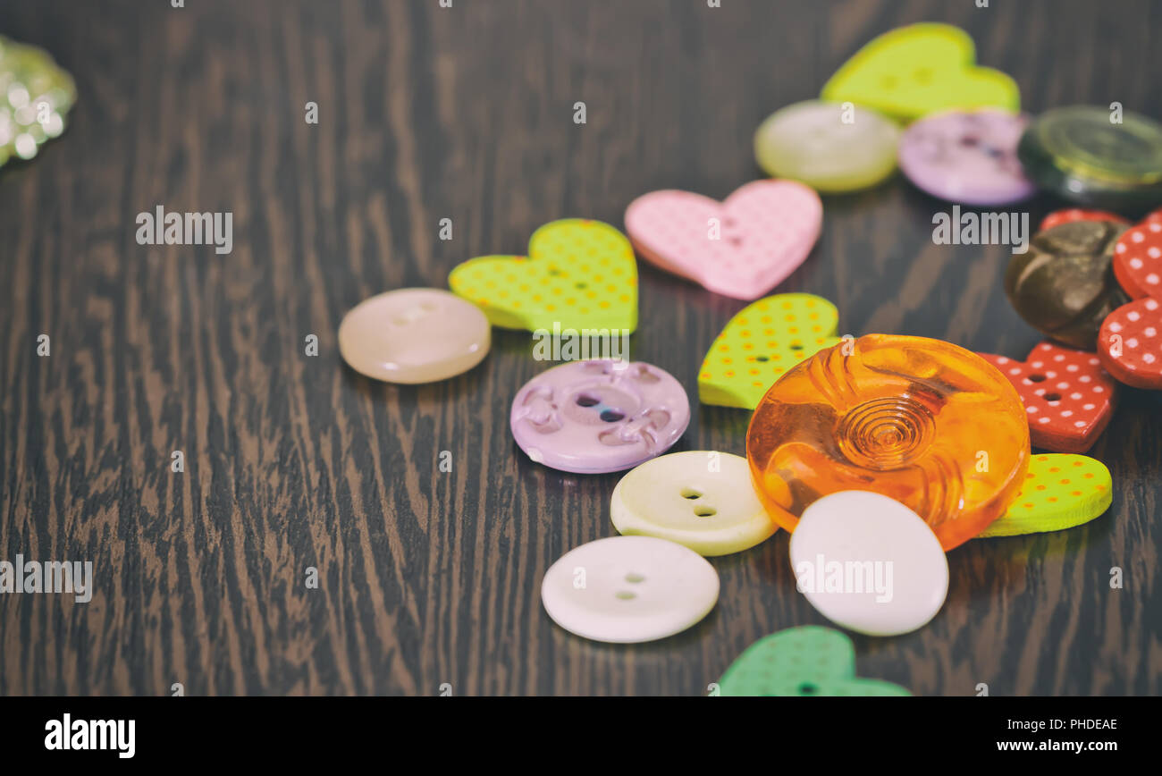 Buttons dark tones are on the table Stock Photo