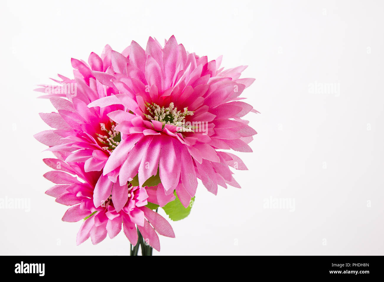 Small Pile of Dirt with Fake Flowers Isolated on White Background Stock  Photo - Alamy