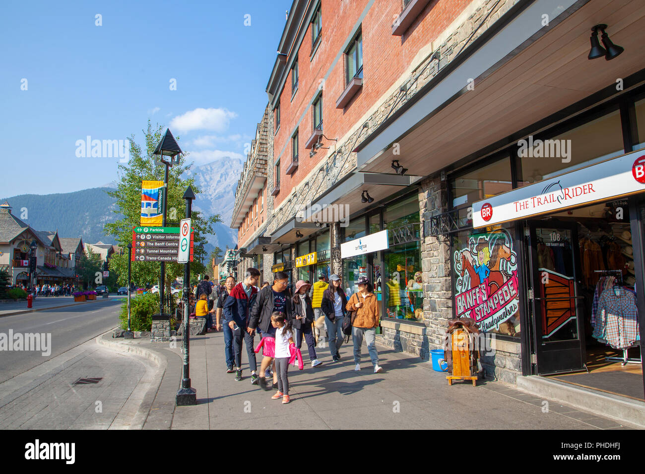 BANFF, CANADA - AUG 20, 2018: Visitors walking on Banff Avenue inside Banff National Park in Alberta, Canada. The famous town is renowned for its prox Stock Photo