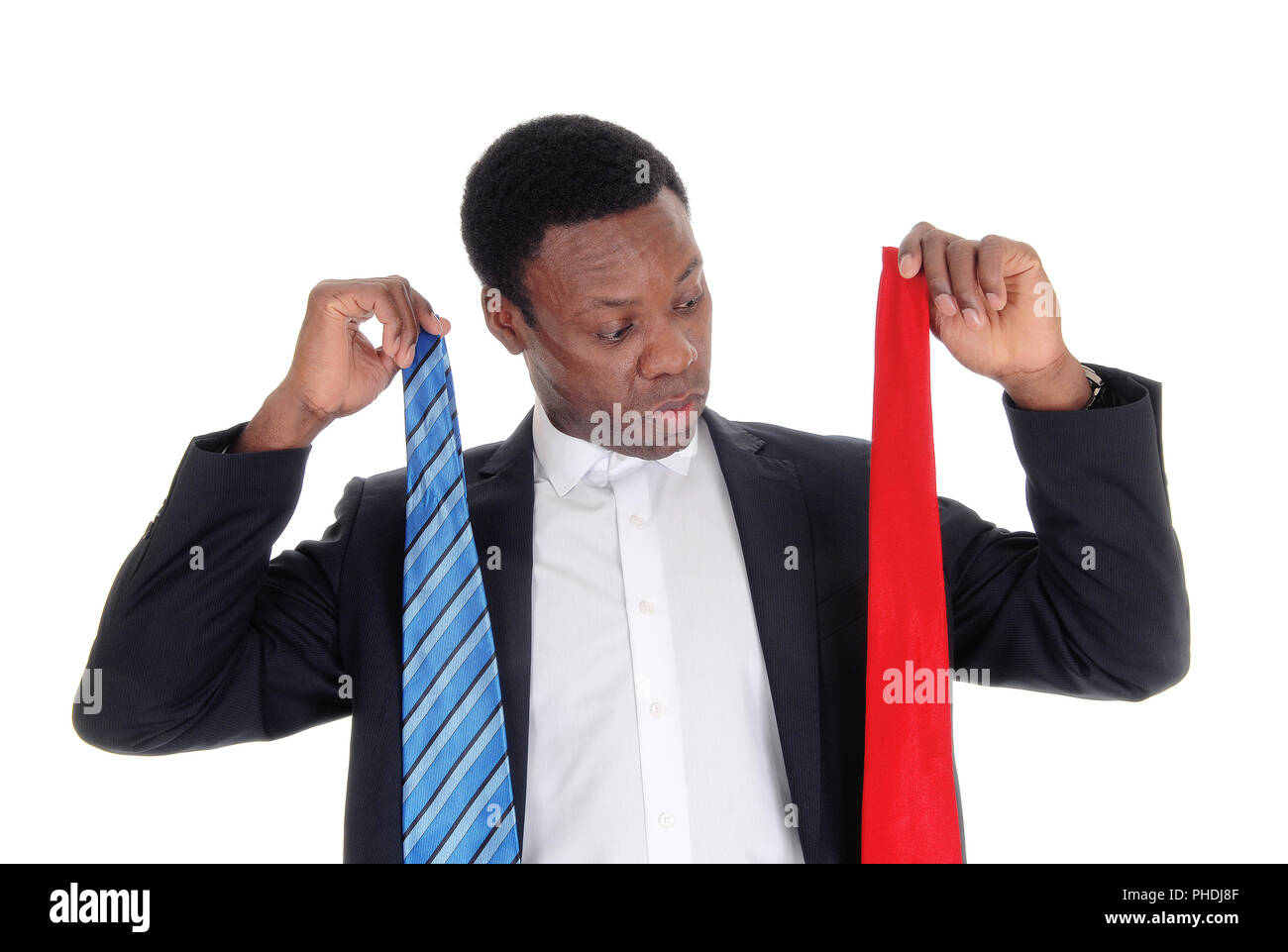 Man can not decide what necktie to wear Stock Photo
